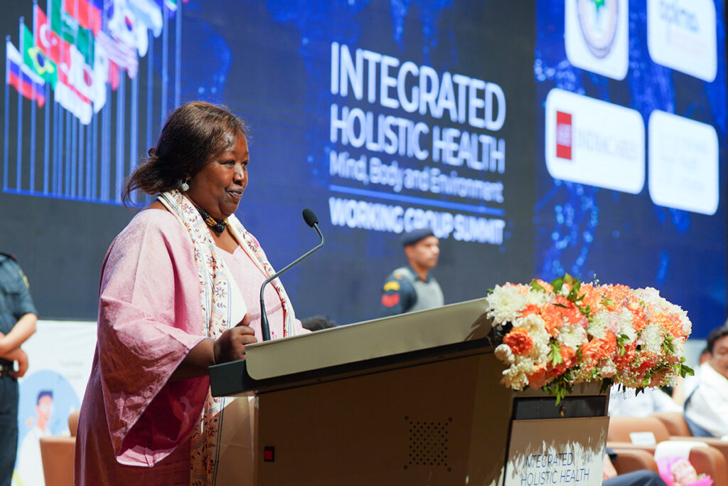 Prof. Agnes Binagwaho, former Health Minister of Rwanda, speaking at the podium. She said we are going forward with hope because we know what we can do to do better.