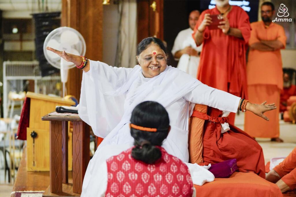 Amma twisting in a yoga pose