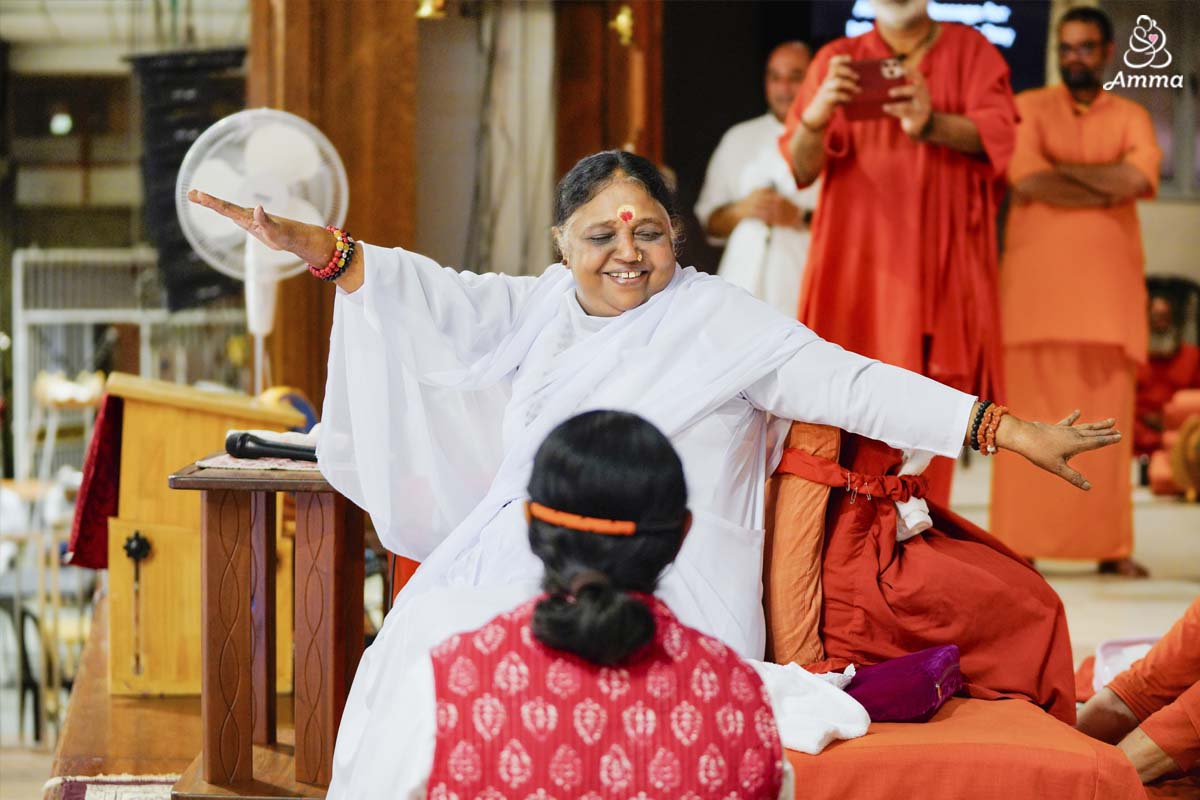 Amma twisting in a yoga pose