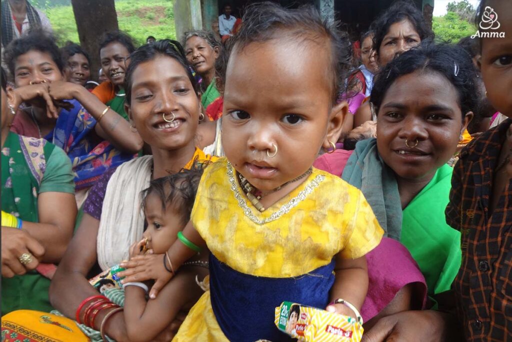 A baby looks at the camera