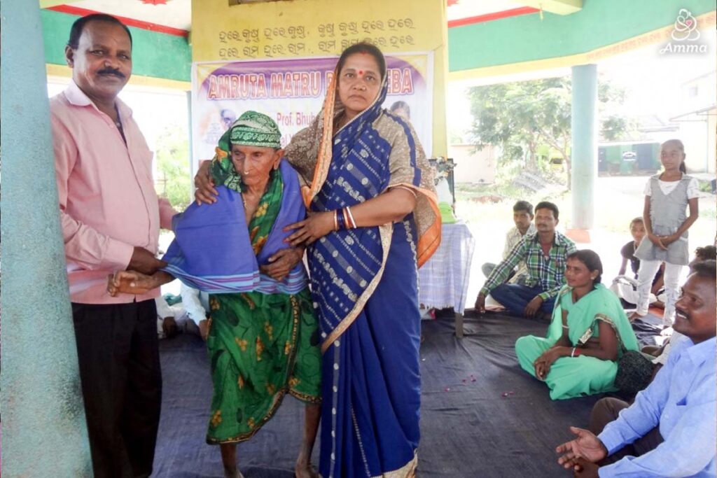 a woman receives a sari