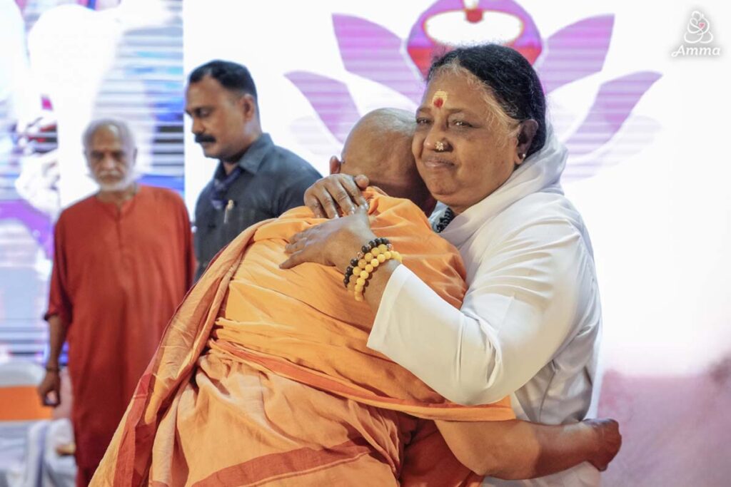 Amma embraces a sanyasini