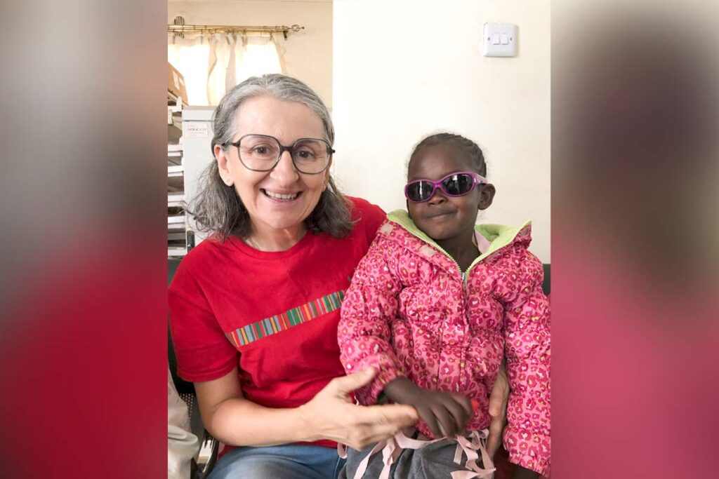 a doctor with a little girl with sunglasses