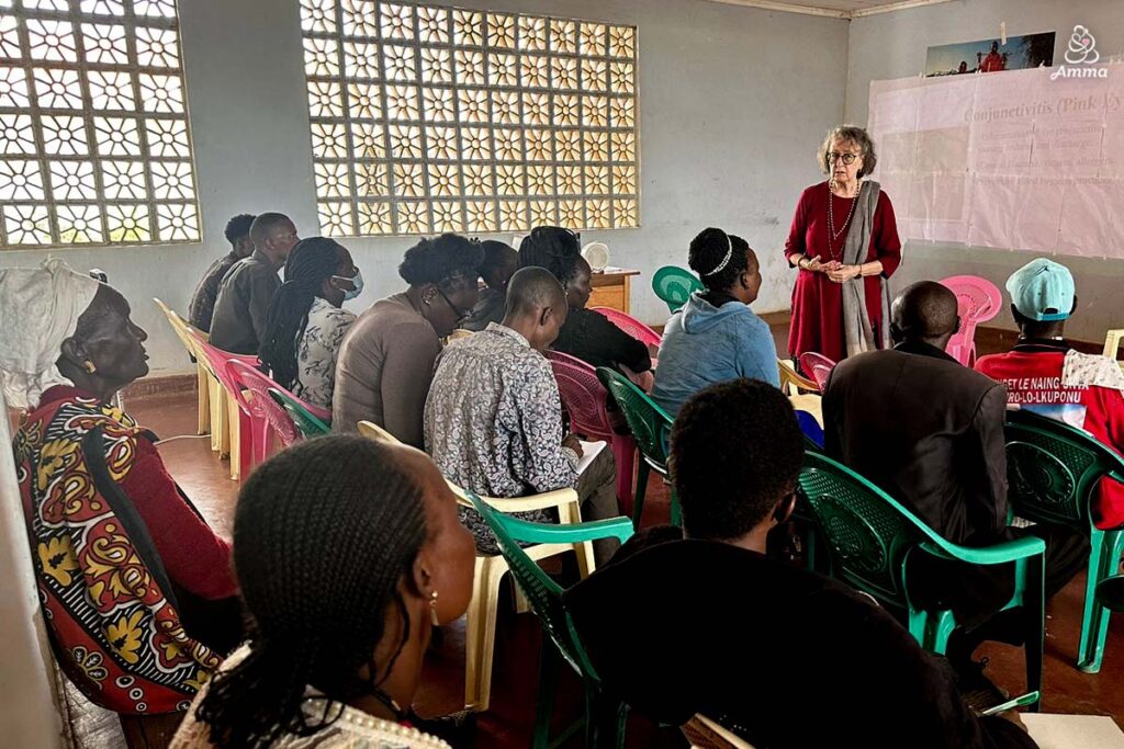 a woman addresses a class