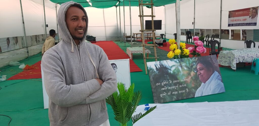 a volunteer standing inside the tent