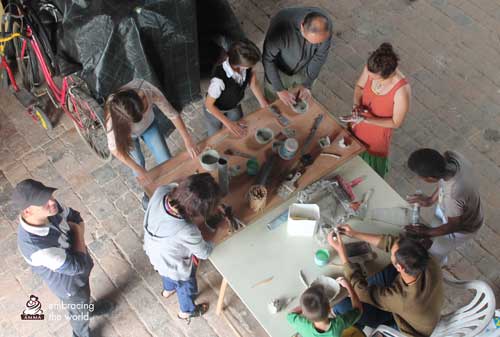 Volunteers make pottery