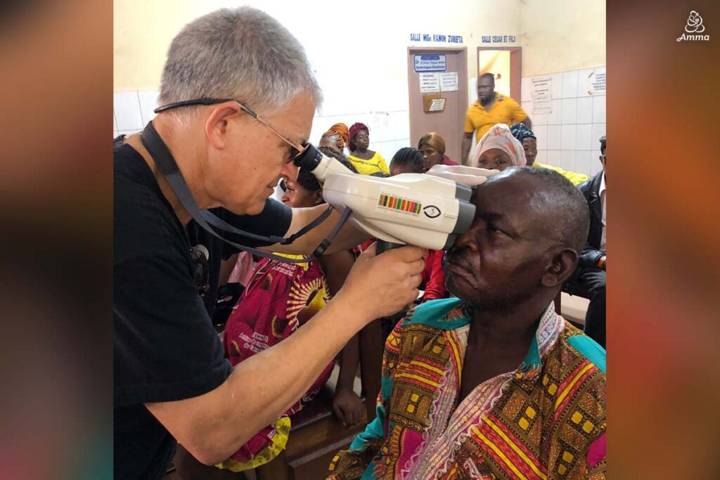 An opthamologist examines a patient