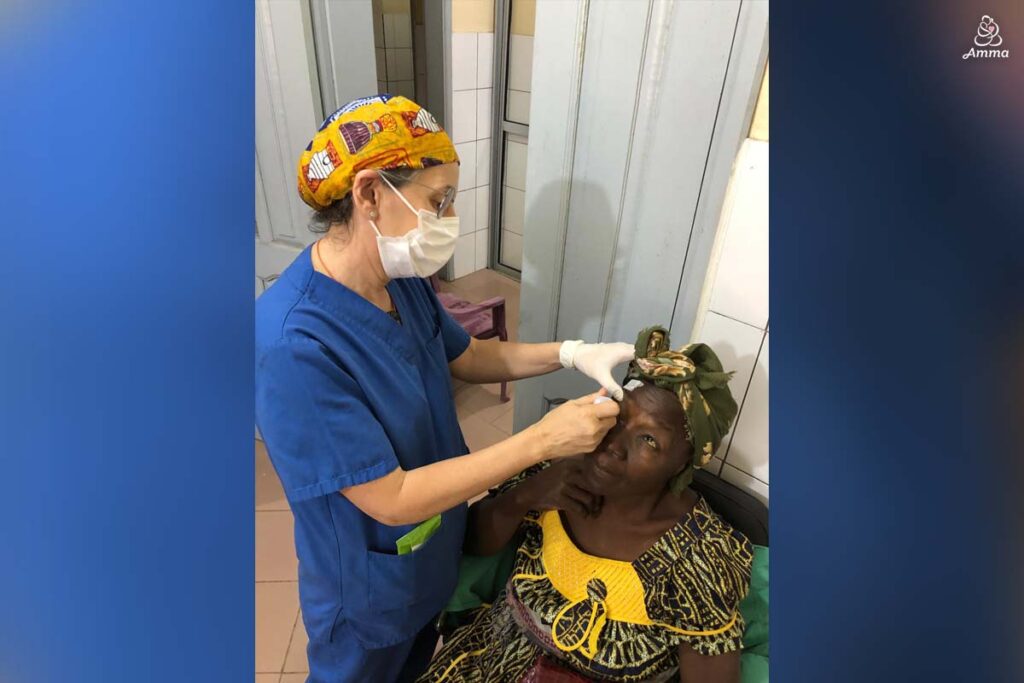 An optometrist examines a patient