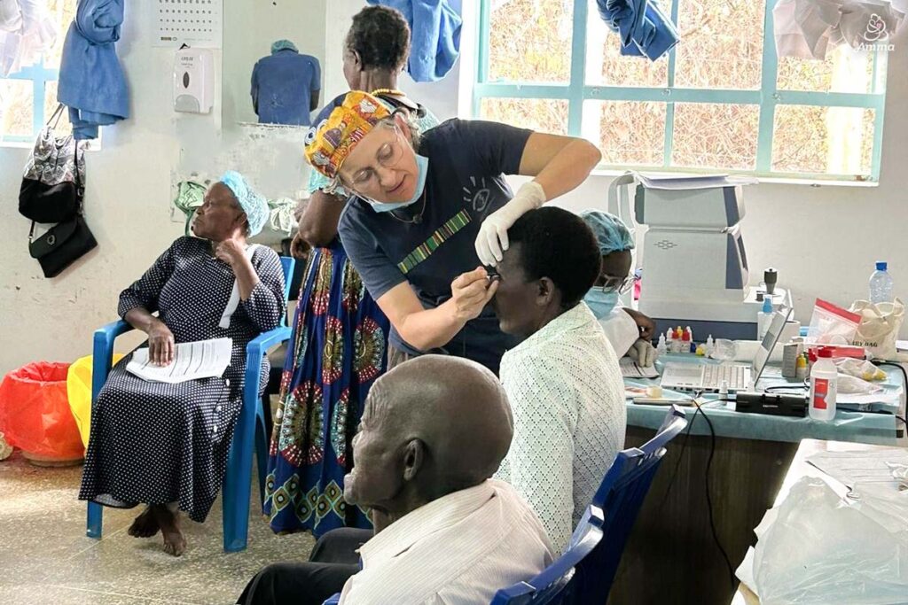 An optometrist exams a patient