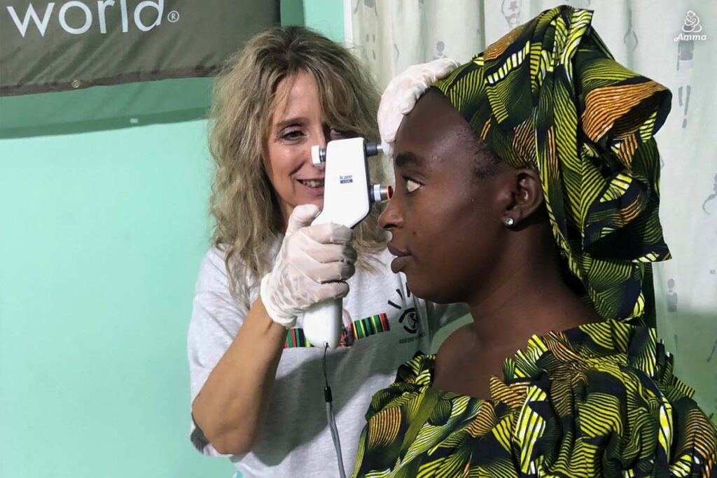 An optometrist scans a patient's eye