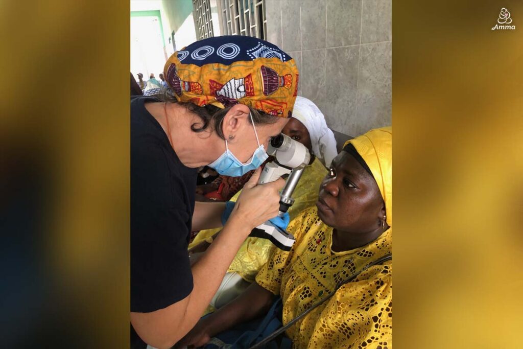 An optometrist scans a patient's eye