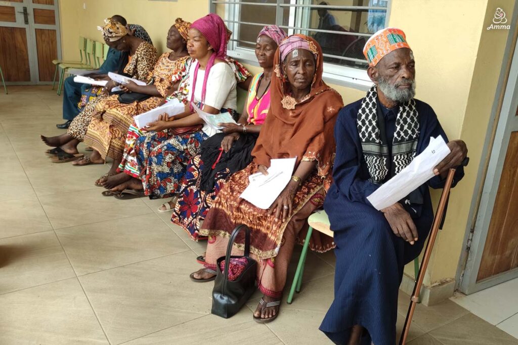 A line of people wait for cataract surgery