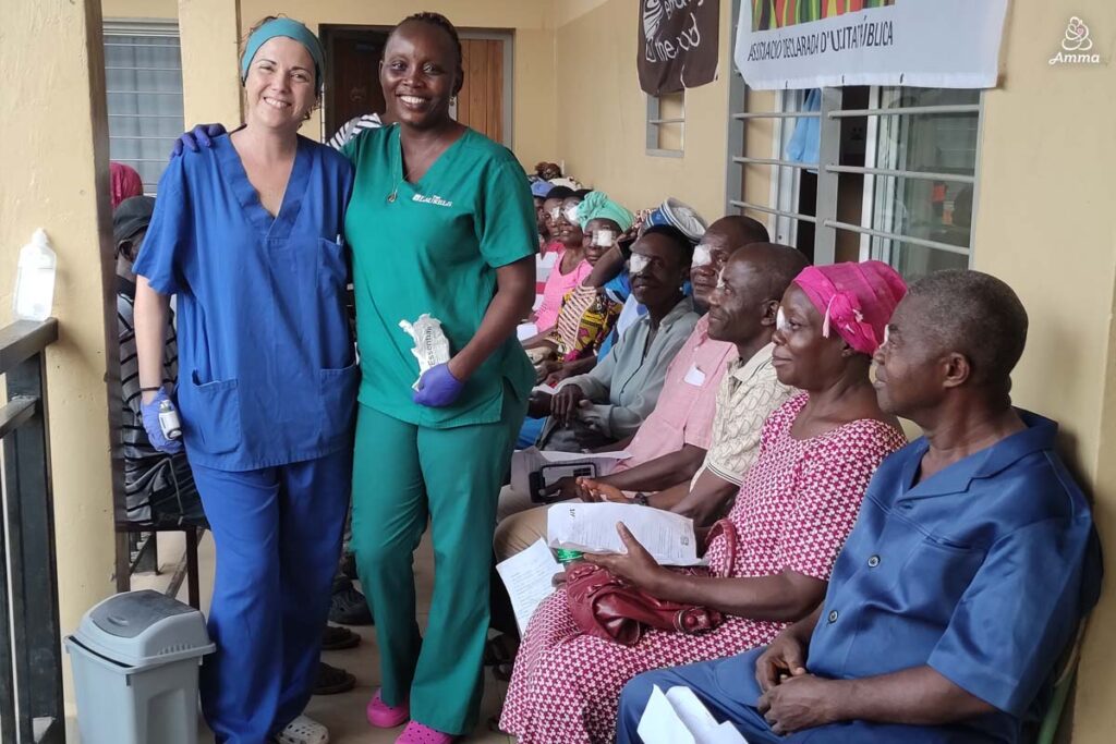 Two healthcare workers with patients after cataract surgery