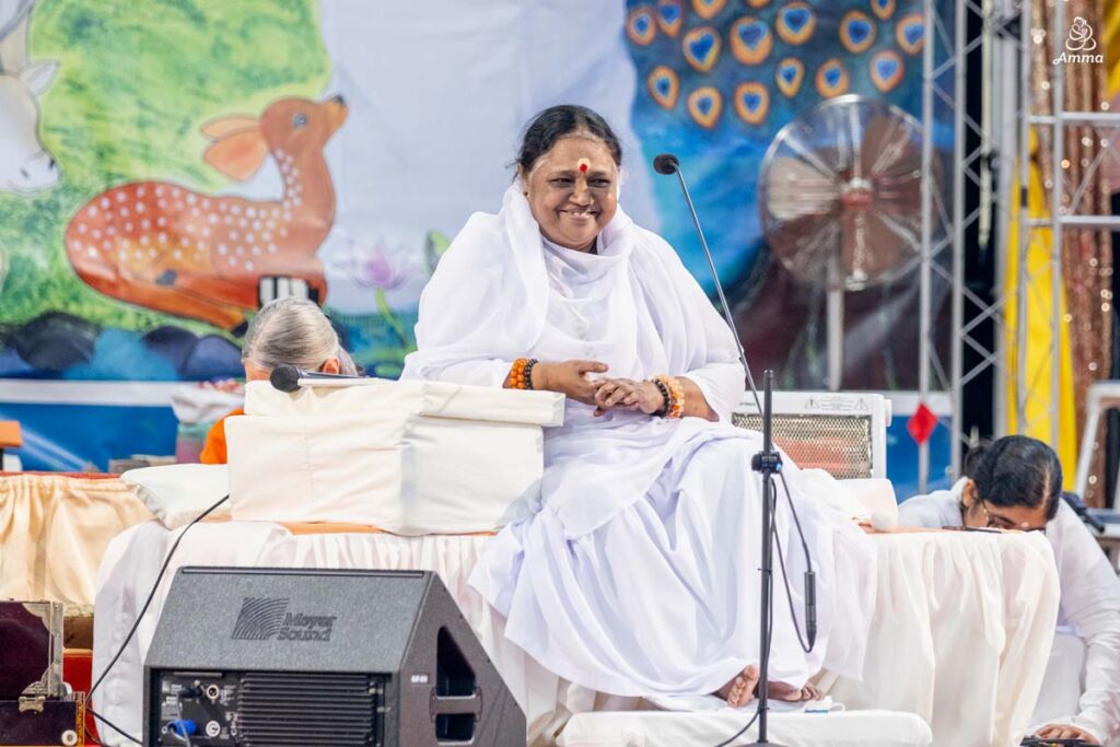 Amma smiles at the people gathered
