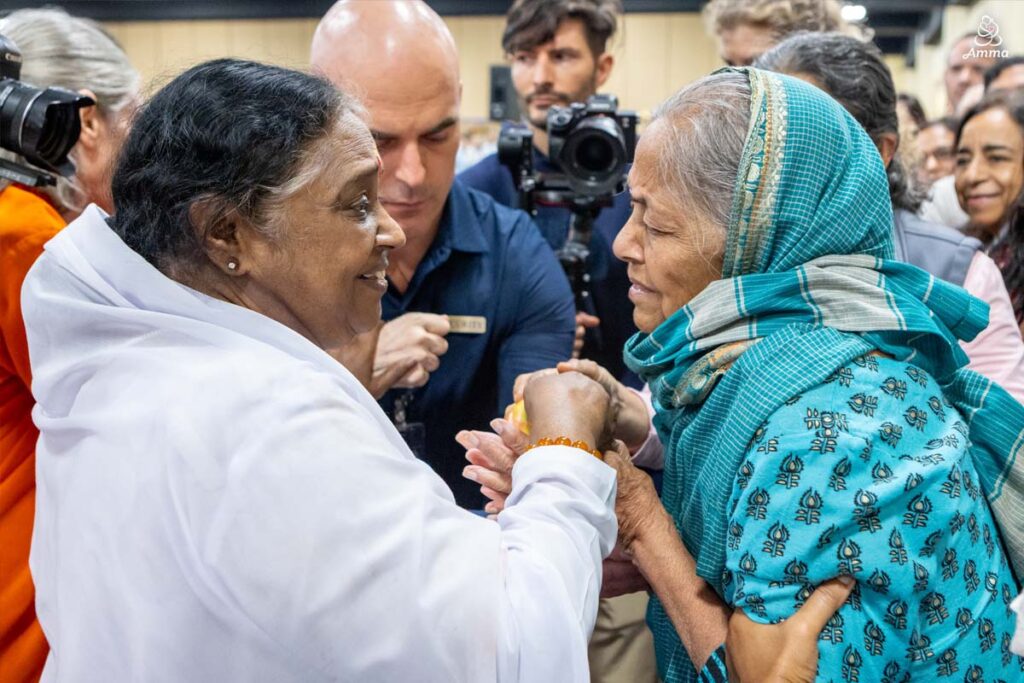 Amma with an elderly woman