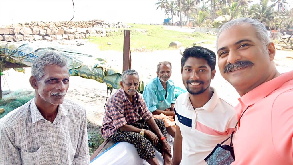 A PhD researcher with local fishermen