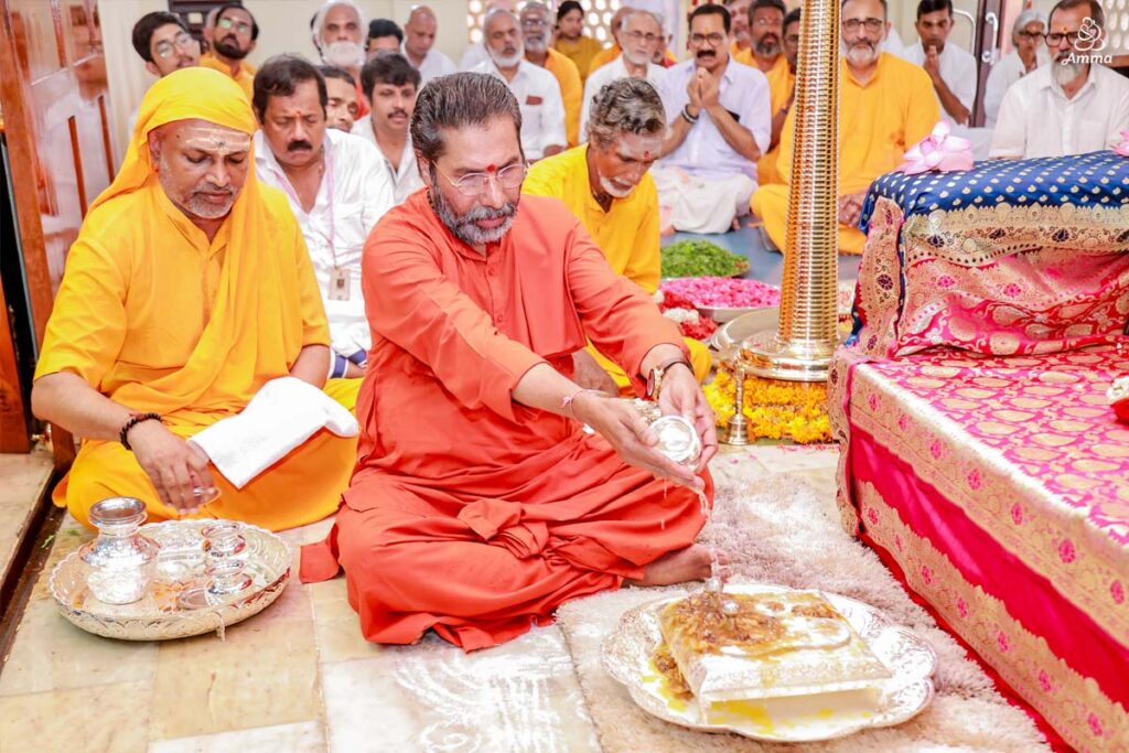 A Swami performs puja