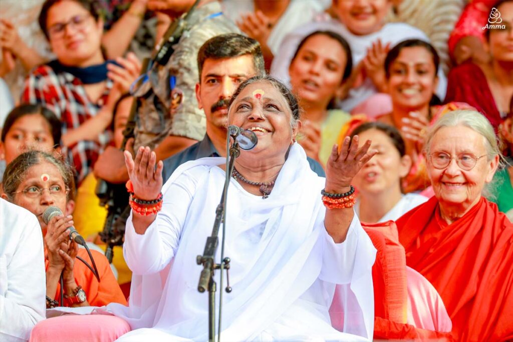 Amma with a smile looking towards the sky