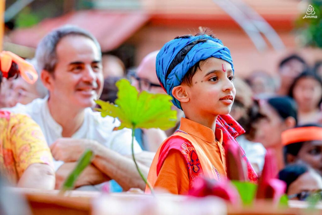 A little. boy dressed as Krishna