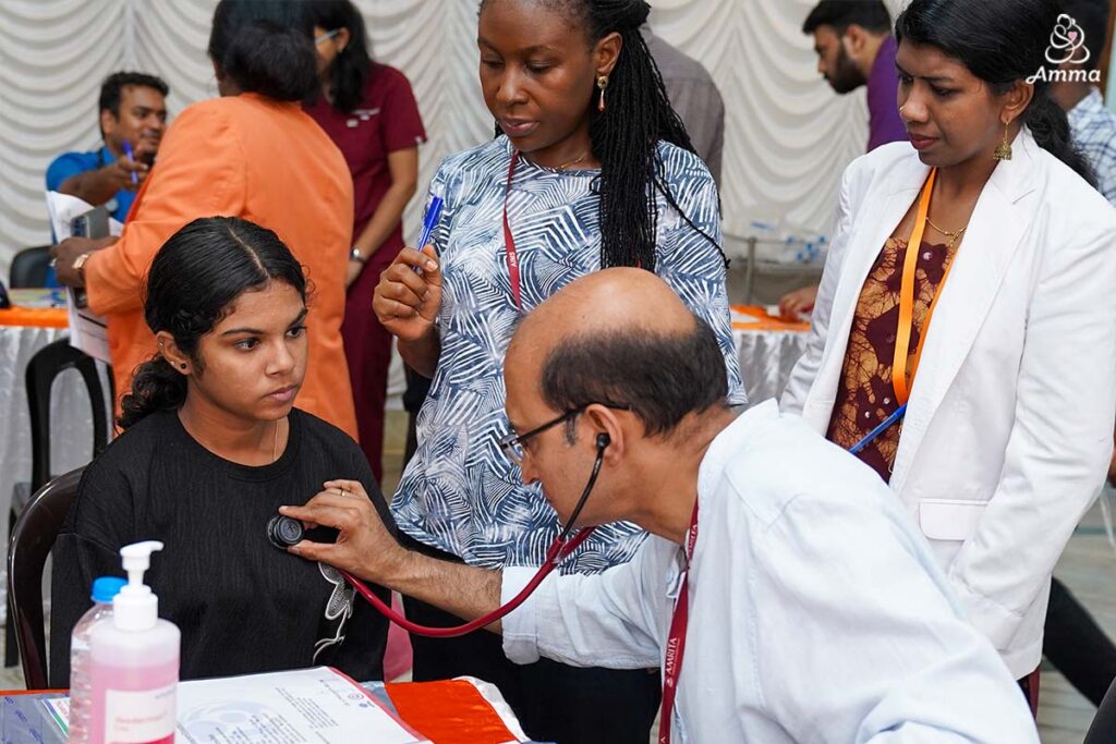 a doctor takes a young girl's heartbeat