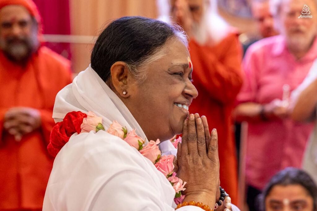 Amma with hands in prayer