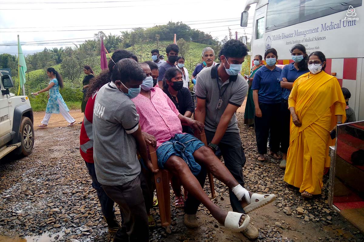 A medical team carries an injured man