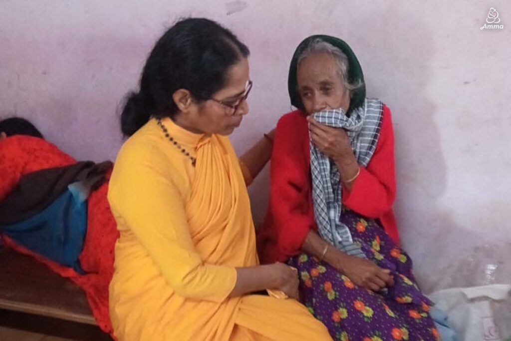 A woman comforts an elderly woman