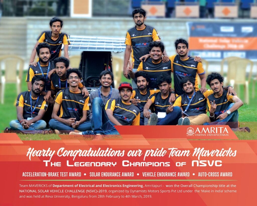 Team Maverick members dressed in their uniforms pose with their vehicle.  Text in image says 'Hearty Congratulations our pride Team Mavericks - the legendary champions of NSVC'