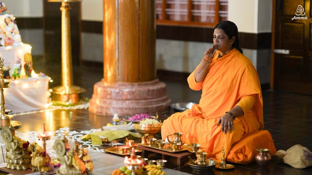 A woman priest conducts a puja