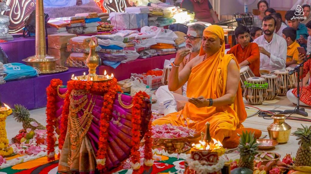 A pujari conducts throws petals