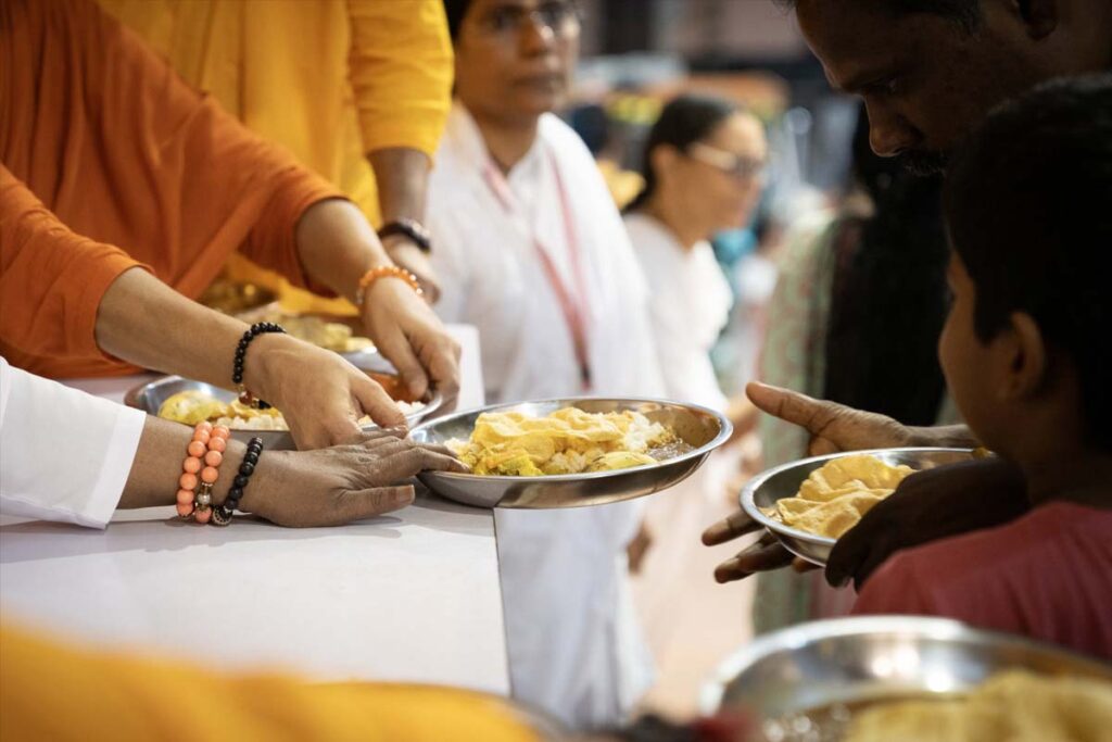 Amma distributes prasad