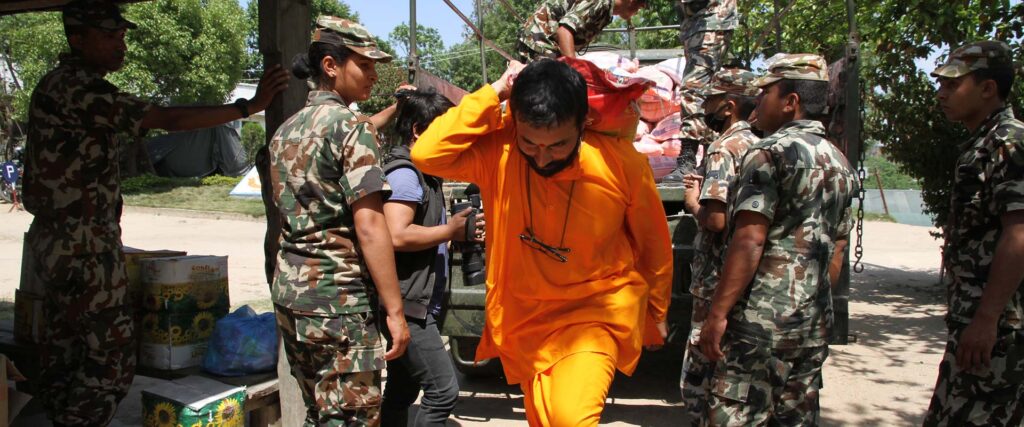Swami carries supplies on his back