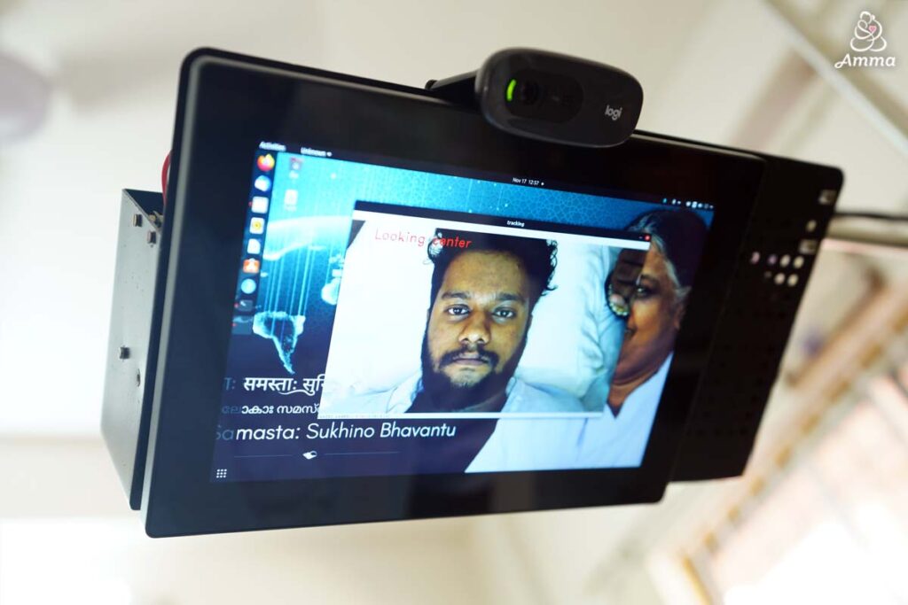 a tablet with a man's image at the centre