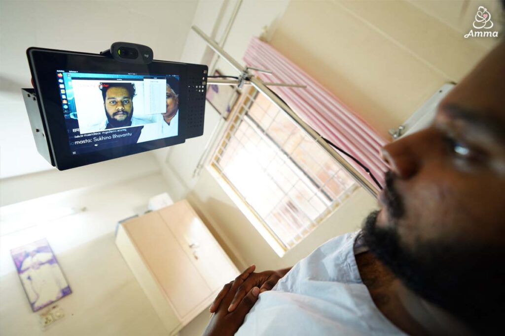 a man looks up at a tablet device above him
