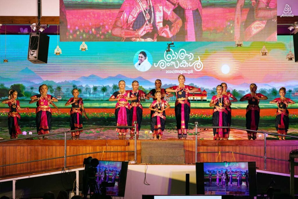 A group of girls dance Bharatnatyam