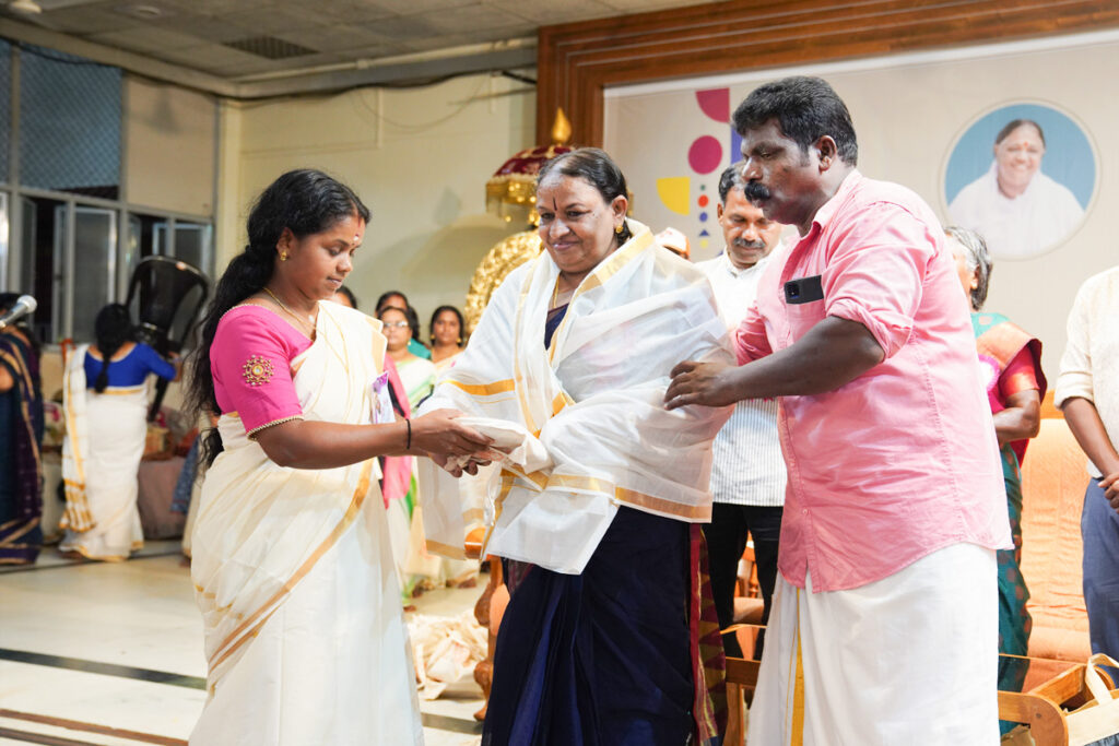 A woman alumni was honoured for her contribution to uplifting her community with a Kerala cloth adorning her.