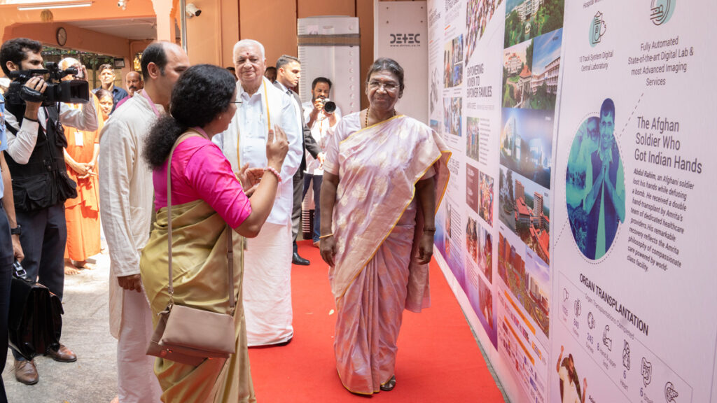 Dr. Maneesha V Ramesh, Provost of Amrita Vishwa Vidyapeetham, discussing MAM's global humanitarian work with the President.