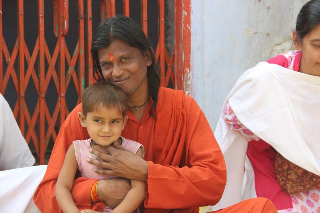 a swami with a child
