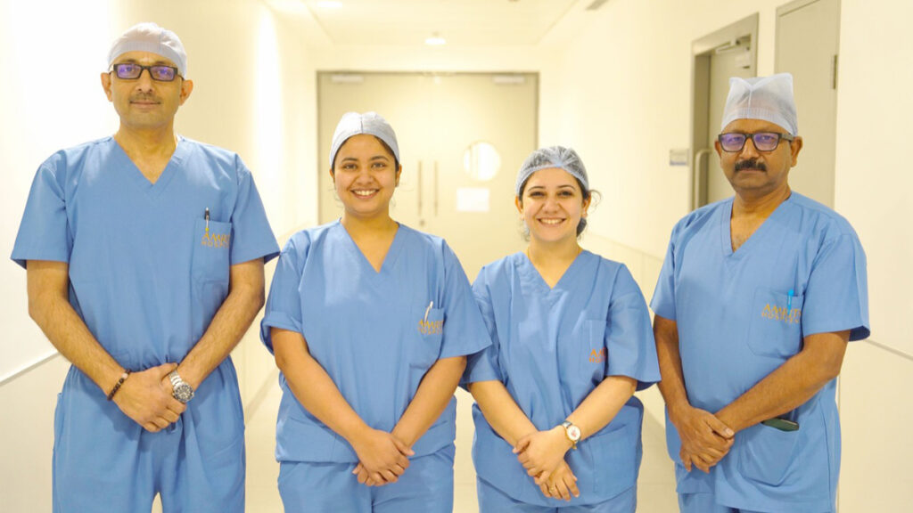 The surgical team, smiling after a successful operation