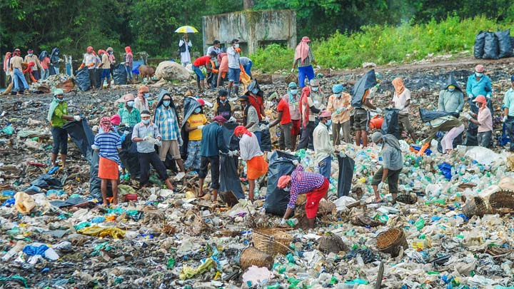 People cleaning up massive amounts of trash