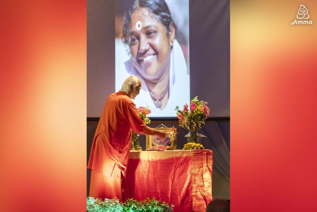 Swamiji lights a lamp