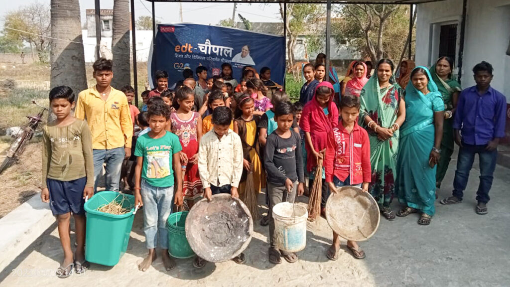 Children stand with baskets ready to clean