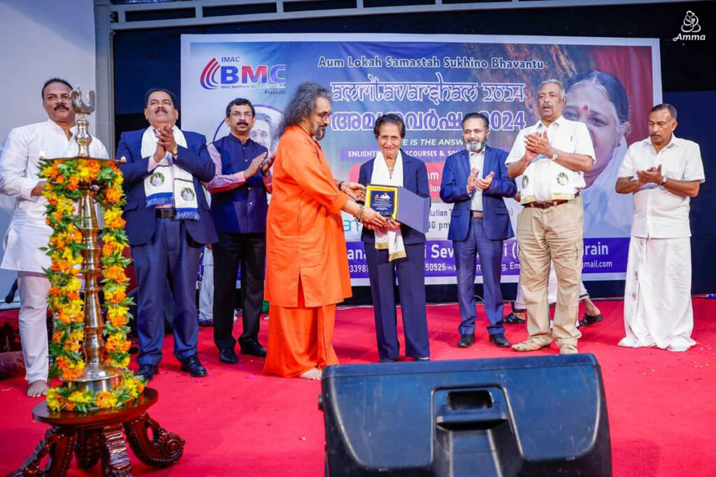 Swamiji gives an award