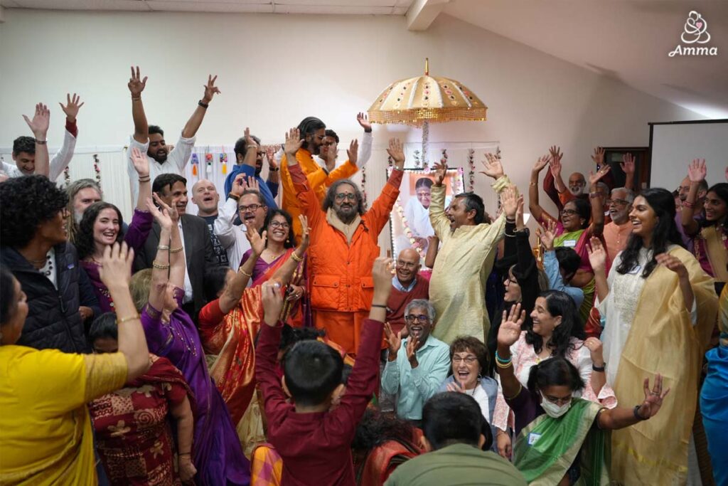 A gathering in Ann Arbor, Michigan joyfully raises their hands