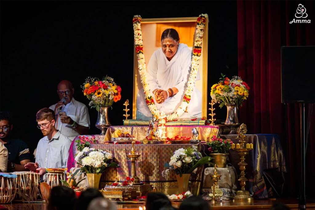Amma's large photo flowers and oil lamps