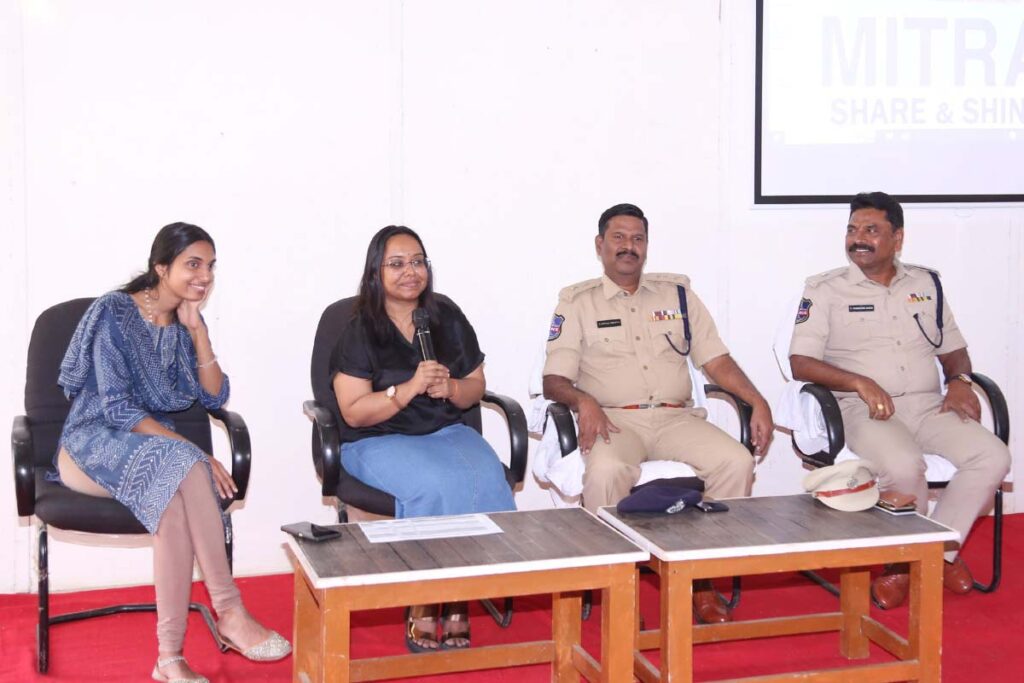 Two women with Amrita and two officers