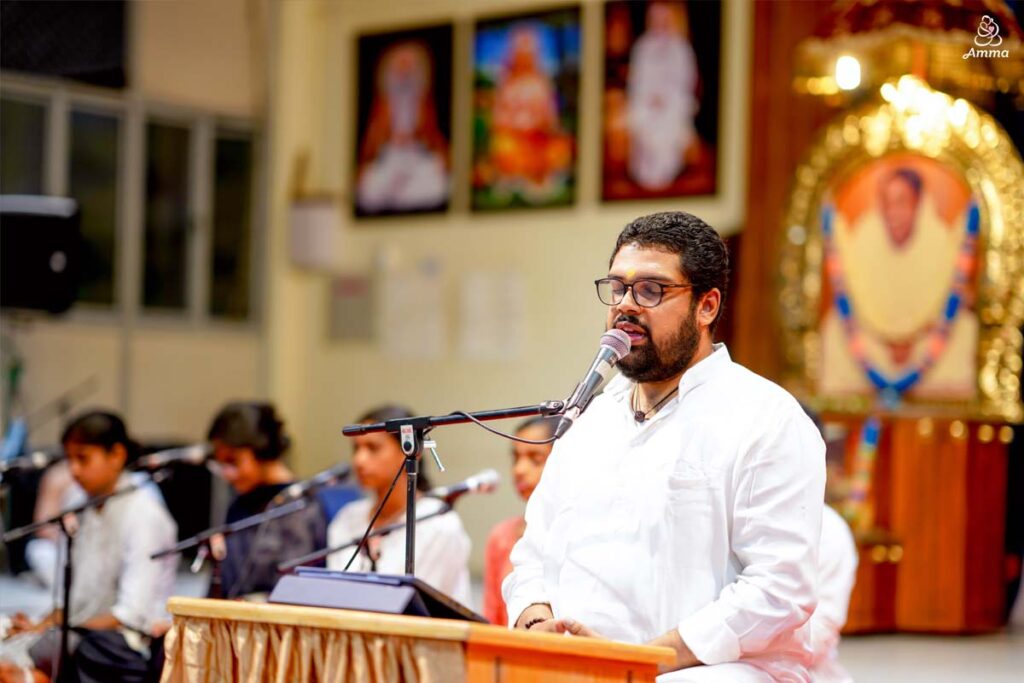 A man speaks at a microphone