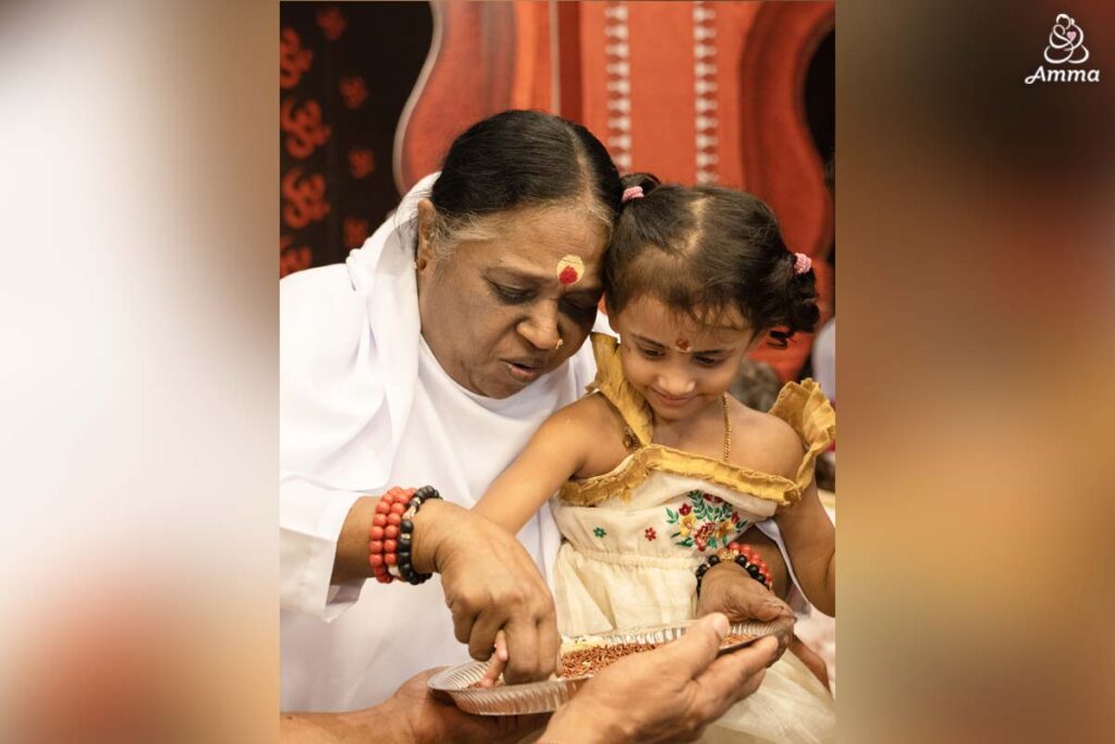 Amma with a child