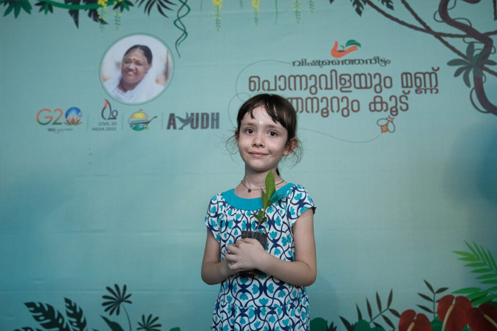 Tulsi is one of many Ashram children who will carefully plant saplings for her future world.