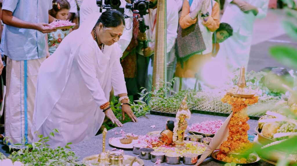 Amma paying reverence to saplings